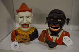 Two cast iron money banks.