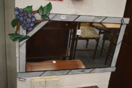 Rectangular mirror with stained glass frame.