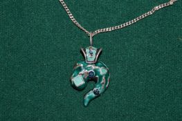 An enamel pendant and chain.