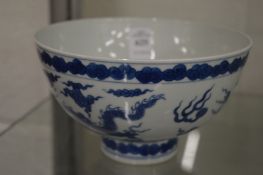 A good Chinese blue and white dragon bowl with four character mark to the base.