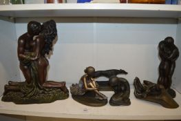 A collection of bronze resin sculptures.