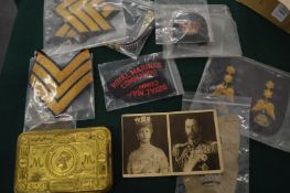 A Queen Mary Christmas tin and other items.