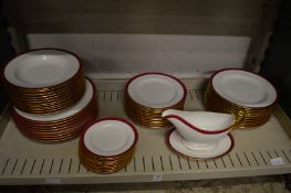 A Spode part dinner service, white ground with red and gilt border.