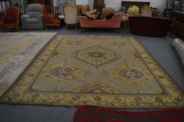 A large Indian carpet, cream ground with stylised decoration, 380cm x 365cm.