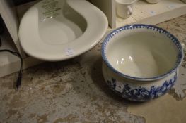A blue and white chamber pot and a slipper pan.