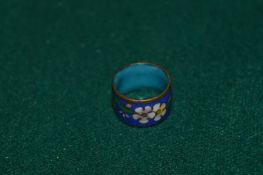 A cloisonne ring.
