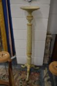 A carved and painted torchere.