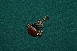 9ct gold spinner fob set with carnelian and blood stone.