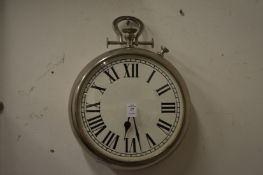 A wall clock modelled as a large pocket watch.