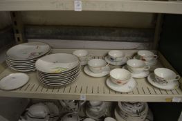 A Limoge floral decorated part service.