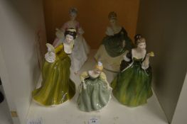 A small collection of Royal Doulton figurines.