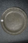 An 18th century pewter charger with wriggle work decoration, probably marriaged item dated 1791.
