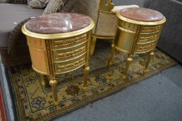A pair of French style gilt wood and marble top three drawer chests.