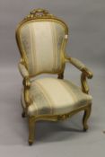A FRENCH STYLE GILT FRAMED FAUTEUIL, with carved wood frame, classical style upholstery, on
