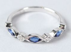 AN 18CT WHITE GOLD SAPPHIRE AND DIAMOND HALF ETERNITY RING.