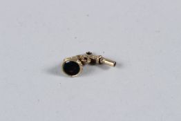 A SMALL SILVER GILT PISTOL SHAPED WATCH KEY, the butt inset with a bloodstone. 2CMS LONG.