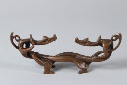 A CHINESE BRONZE DRAGON. 17cms high.