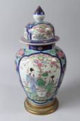 A 19TH CENTURY JAPANESE PORCELAIN VASE AND COVER, with ormolu mounts, the vase painted with panels
