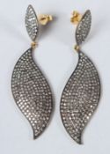 A PAIR OF GOLD AND SILVER PAVE SET GOLD LEAF SHAPE EARRINGS.