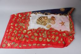 A LARGE SCARF, decorated with seashells. 16cms x 120cms.