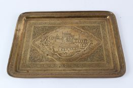 A 19TH CENTURY ISLAMIC BRASS TRAY. 50.5cms x 37cms.