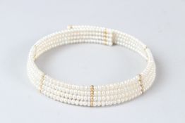 A FRESHWATER PEARL FOUR STRAND CHOKER with 14ct gold mounts.