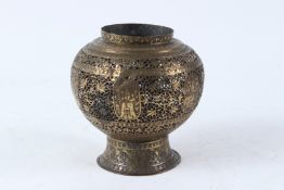 A 19TH CENTURY PERSIAN QAJAR OPEN WORKED BRASS VASE. 15cms high.