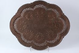 A 19TH CENTURY KASHMIRI COPPER TRAY / TABLE TOP with pierced decoration. 73cms x 60cms.
