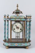 A DECORATIVE CLOISONNE MANTLE CLOCK, with shaped finial. 46cms high.