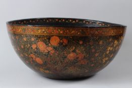 A VERY LARGE AND FINE 19TH CENTURY INDIAN KASHMIRI LACQUERED PAPIER MACHE BOWL. 45cms diameter.