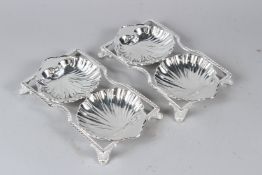 A PAIR OF PLATED DOUBLE SHELL SHAPED DISHES. 25cms wide.