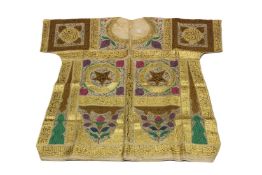 AN OTTOMAN TALISMATIC SHIRT, 19TH CENTURY, inscribed throughout with black and red ink. 105cms