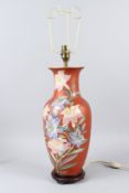 A 20TH CENTURY CHINESE PORCELAIN VASE LAMP AND SHADE, painted with flowers. Lamp 40cms high exc.