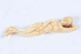 A DOCTOR'S BONE FEMALE FIGURE. 12cms high.