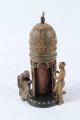 A VIENNA STYLE COLD PAINTED BRONZE GROUP OF ARAB FIGURES BY A TOWER. 30cms high.