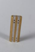 A CARTIER LIGHTER, gilt metal with a pair of aluminium strips to the body, boxed.