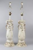A PAIR OF ROYAL DUX PORCELAIN TABLE LAMPS modelled as Art Nouveau twin handled vases. 92cms high