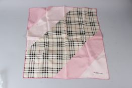 A BURBERRY SILK SCARF, pink and check design. 47cms x 47cms.