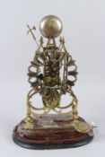 A 19TH CENTURY BRASS SKELETON MANTLE CLOCK on an oval shape wooden base, lacking glass dome. 40cms