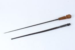 A SWORD / SWAGGER STICK WITH CARVED BONE HANDLE, converted from a bayonet. 66cms long.