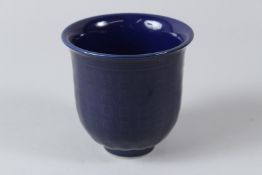 A CHINESE RICH BLUE GROUND PORCELAIN CUP, 20TH CENTURY, with calligraphy decoration, bears Xuande