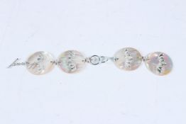 A SILVER AND MOTHER-OF-PEARL BAT BRACELET.
