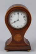 AN EDWARDIAN INLAID MAHOGANY BALLOON SHAPED MANTLE CLOCK. 23cms high.