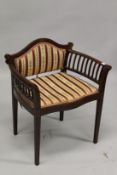 AN EDWARDIAN INLAID MAHOGANY MUSIC OR DRESSING TABLE CHAIR, with upholstered back panel and seat,