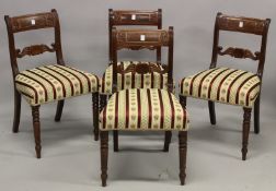 A SET OF FOUR EARLY 19TH CENTURY MAHOGANY DINING CHAIRS, with carved cresting rails and tie bars,