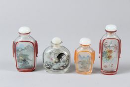 FOUR CHINESE REVERSE PAINTING GLASS SNUFF BOTTLES, two painted with female figures, one with a