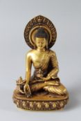 A GILT BRONZE STATUE OF SHAKYAMUNI BUDDHA. 18cms high.
