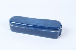 A TURKISH OTTOMAN BLUE CERAMIC PEN BOX, the inside lid blue and white. 23cms long.