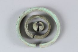 TWO ANCIENT ISLAMIC BRONZE BANGLES together with a similar ring. Largest 10.5cms diameter.