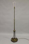 A CLASSICAL STYLE BRASS FLOOR STANDING LAMP, with fluted stem, on a circular base. 142cms high.